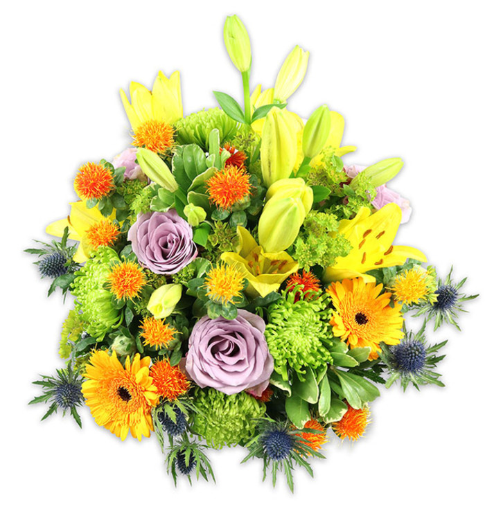 A sumptuous, garden-rich bouquet is arranged with the confidence of a seasoned florist and set against a pristine white field to let each colour sing. Dominant yellow Asiatic lilies reach up through the mass-some opened wide to show their freckled throats and pollen-bearing stamens, others held as sleek, chartreuse-tinted buds that lend upward motion and promise. Two or three soft lavender roses sit tucked centrally, their velvety spirals offering a calm, elegant focal point amid the bouquet's energy. Vivid orange Gerbera daisies fan outward like miniature suns, contrasting with compact lime-green cushion chrysanthemums whose dense, ruffled florets give tactile volume and a lively green note. Pockets of small, spherical orange and golden-yellow accent flowers-reminiscent of Craspedia or spiky button blooms-scatter playfully through the design, while several deep blue-grey Eryngium thistles project a sculptural, almost marine edge with their star-shaped bracts. A layered mix of foliage-broad lily leaves, glossy fillers, and feathery greenery-frames and integrates the blooms, creating depth and gentle shadow. Under soft, diffuse lighting the bouquet conveys warmth, celebration, and thoughtful restraint. This is the kind of arrangement Flower Delivery Barkingside would craft for a local anniversary, a congratulatory delivery along Barkingside High Street, or to brighten a home by Fullwell Cross; its textures, colours, and proportions are chosen to feel personal, enduring, and decidedly local.